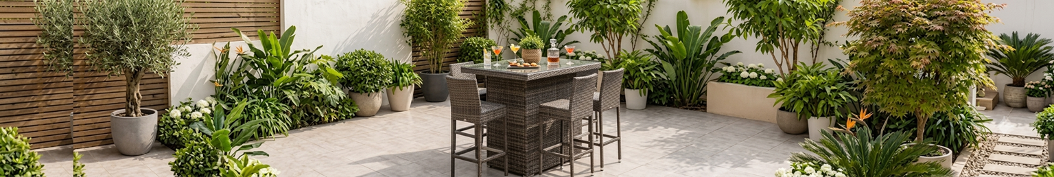 Outdoor rattan bar set with high table and stools on a garden patio