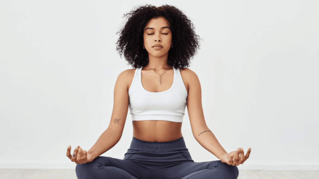 Person practising mindful awareness by listening to their body without judgment