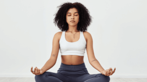 Person practising mindful awareness by listening to their body without judgment