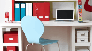Home workstation with an organized desk, ergonomic chair, and essential office equipmen