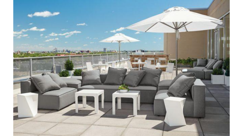 An outdoor furniture market display featuring garden seating, dining furniture, barbeque equipment, and contemporary outdoor living products.