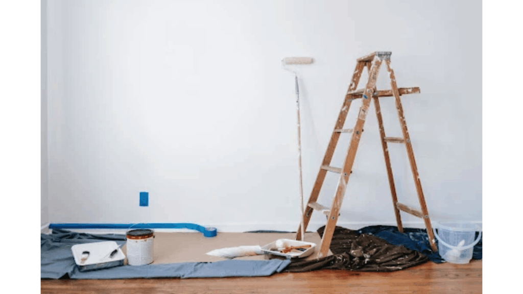 Home remodeling project with renovation materials, furniture, and a credit card representing ways to finance home improvement expenses.