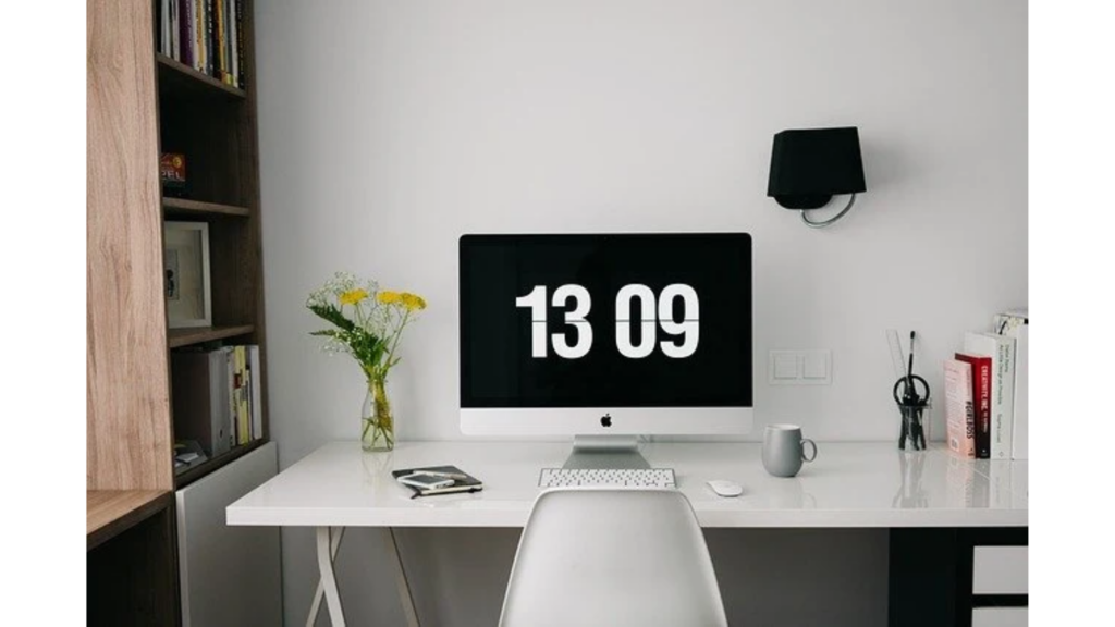 Comfortable home office setup with an ergonomic chair, organised desk, good lighting, and a productive workspace environment.