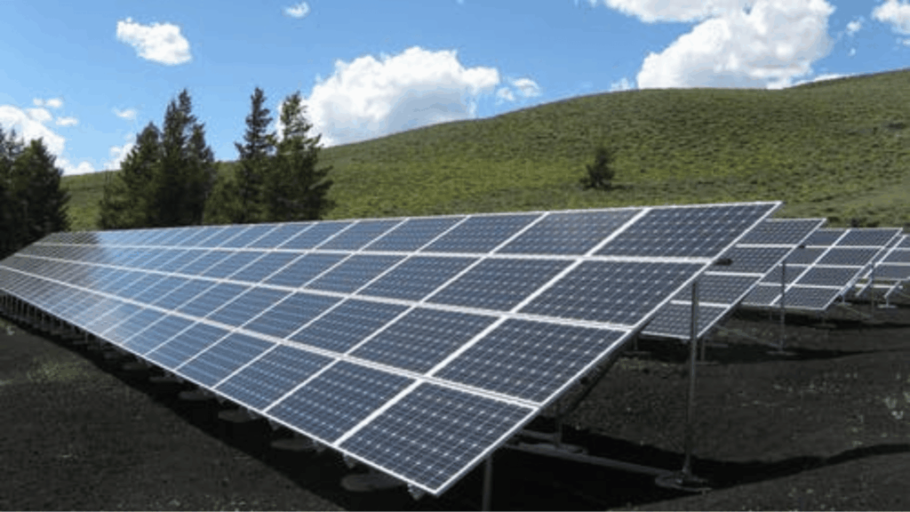 Professional solar panel cleaning service carefully removing dust, dirt, and debris from rooftop solar panels.